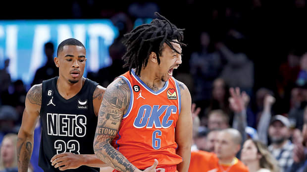 Oklahoma City Thunder forward Jaylin Williams celebrates after scoring a three point basket against the Brooklyn Nets during the first quarter at Paycom Center.